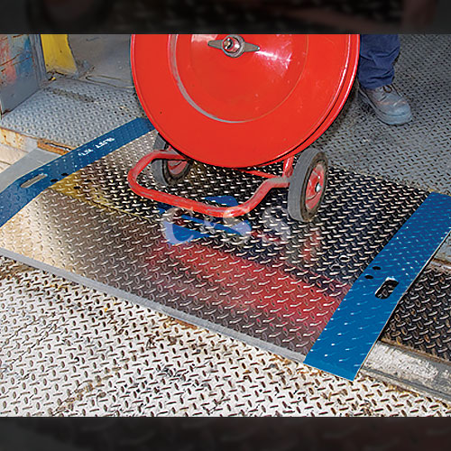 person-using-aluminum-dock-plate-to-load-heavy-item-onto-truck